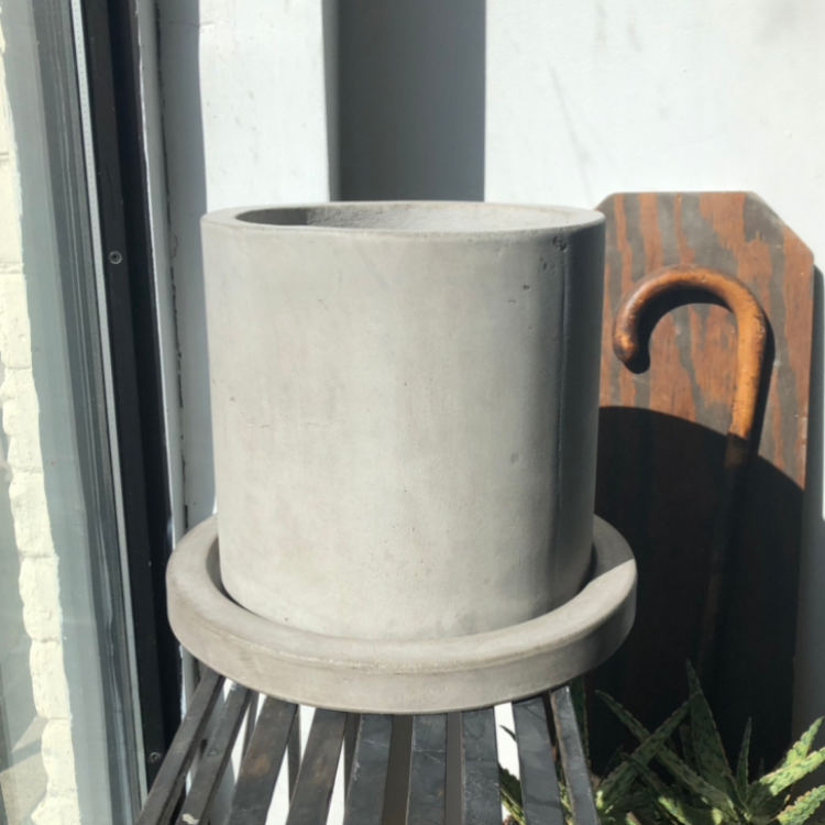 Concrete pot with drainage and saucer.